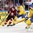 COLOGNE, GERMANY - MAY 11: Latvia's Kristaps Sotnieks #11 plays the puck while fending-off Sweden's Alexander Edler #24 and John Klingberg #3 looks on during preliminary round action at the 2017 IIHF Ice Hockey World Championship. (Photo by Andre Ringuette/HHOF-IIHF Images)


